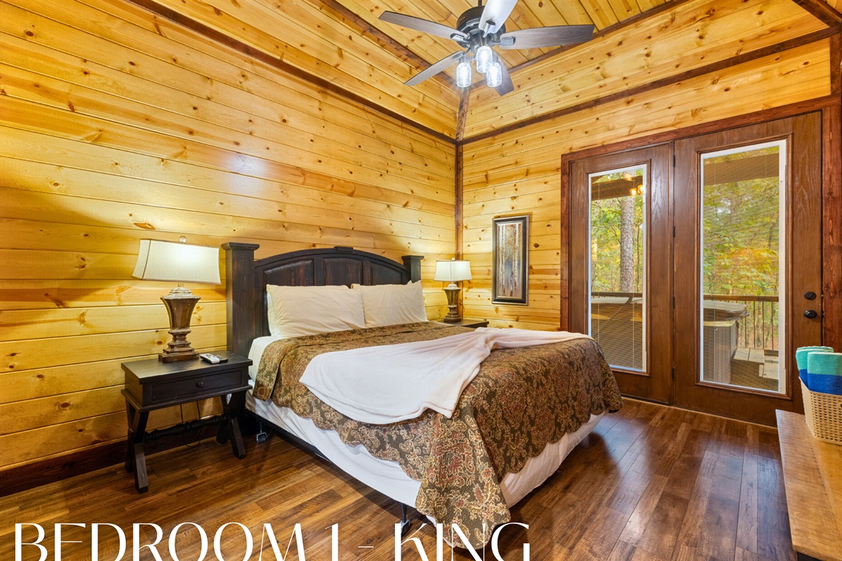 Warm wood walls, comfortable bedding, and rustic charm in every detail.