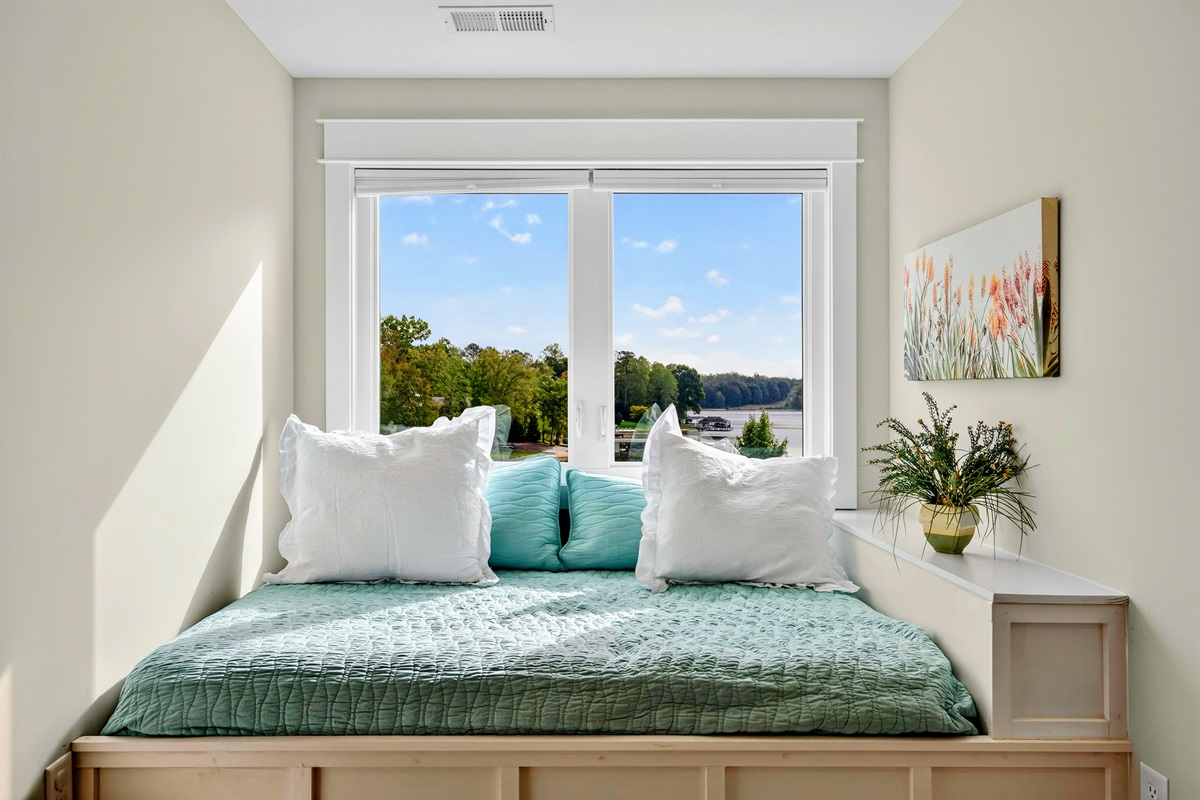This full size window bed is adorable! The lake views are spectacular! It can also serve as such a cute reading nook. this extra bed is a game changer for parents!