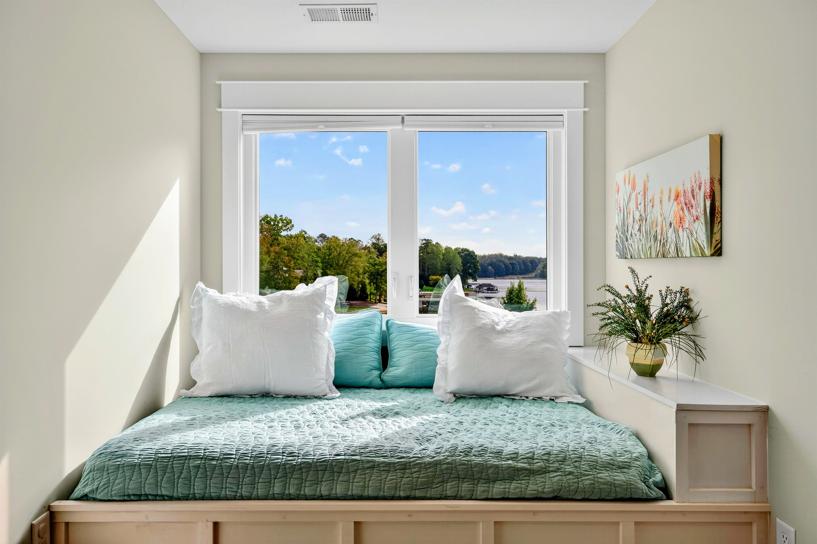This full size window bed is adorable! The lake views are spectacular! It can also serve as such a cute reading nook. this extra bed is a game changer for parents!