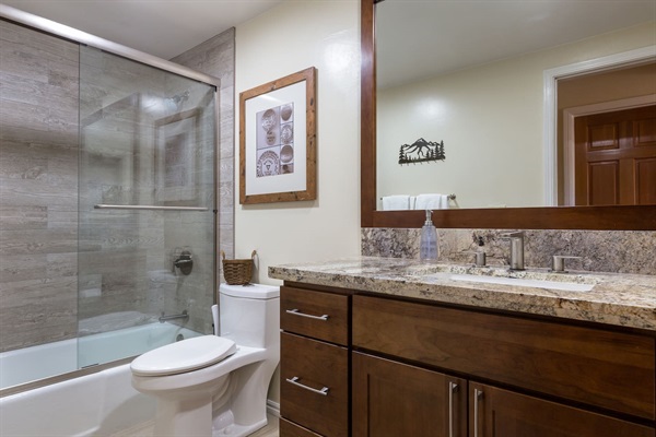 Heated floors, granite slab countertop, quiet (soft-closing) drawers, and more! Bathroom is located outside the bedroom.