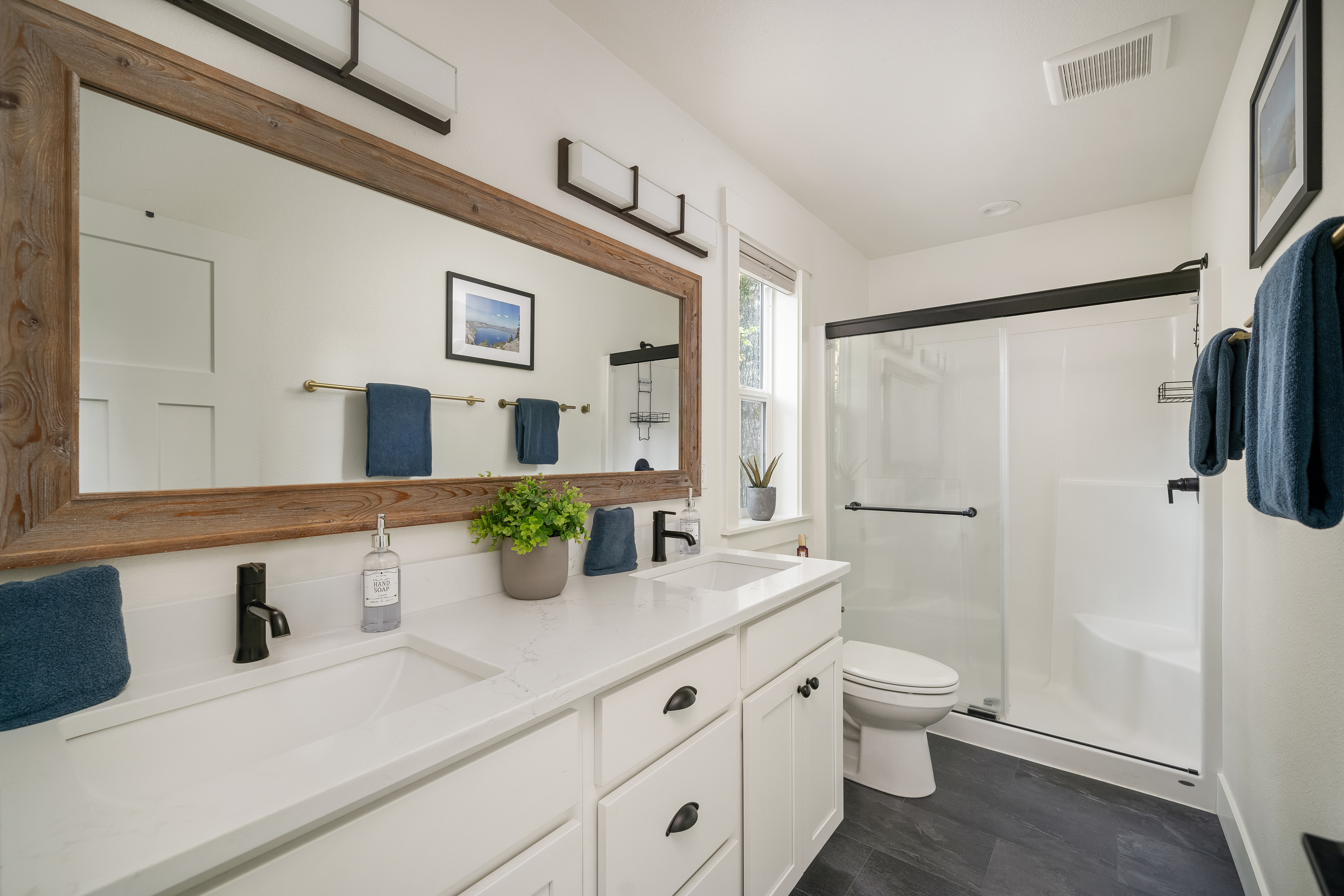 A double-vanity ensuite with a walk-in shower — room for two to get ready at once.