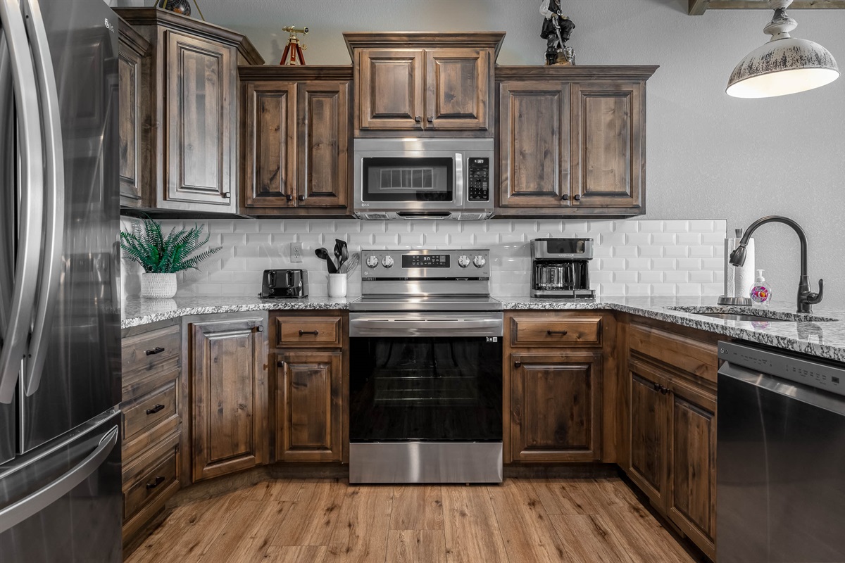 Kitchen with full sized stainless appliances