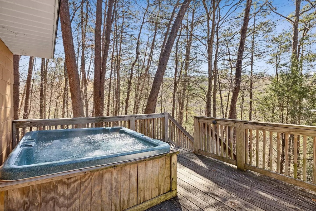 Hot tub on front deck of cabin