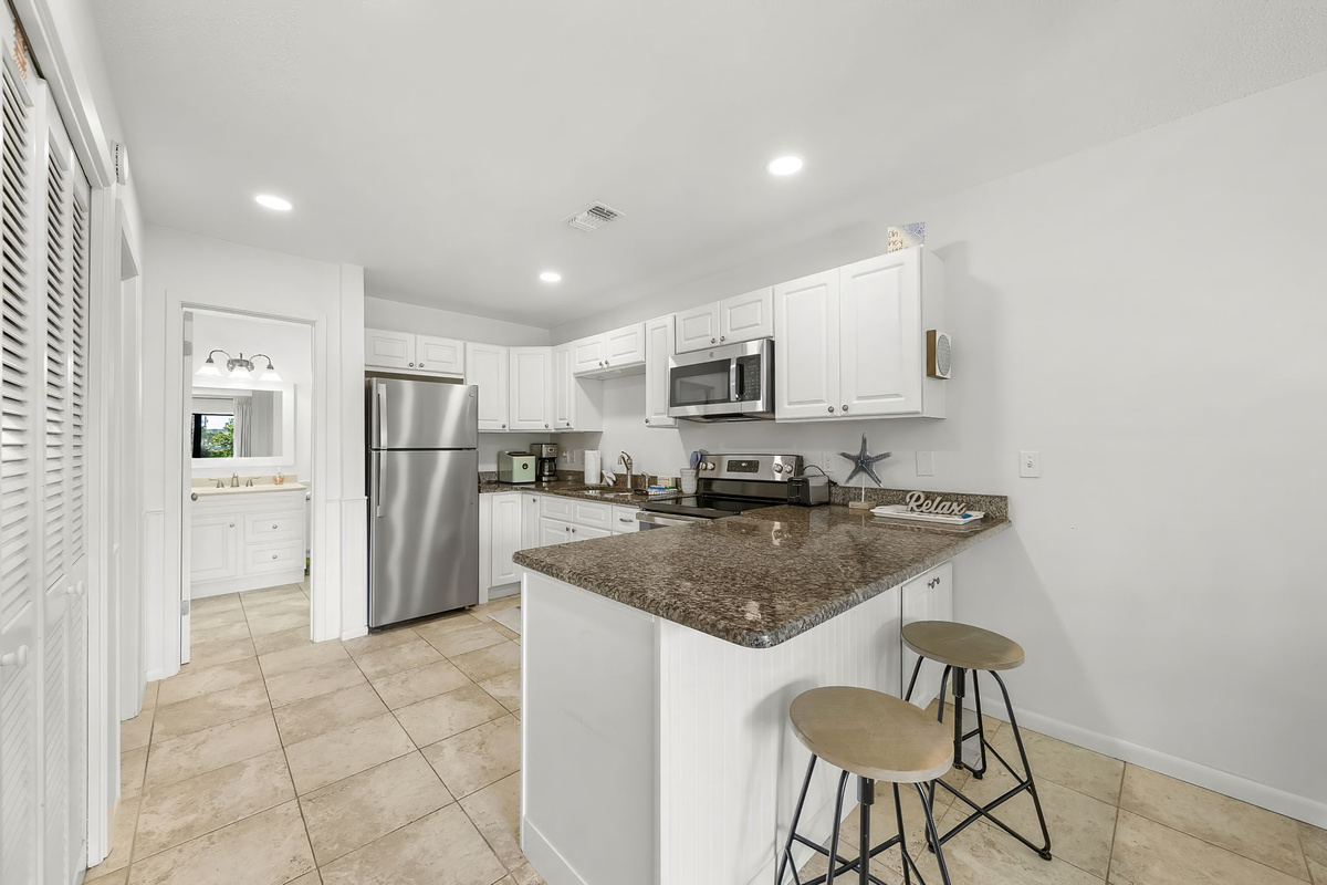 Kitchen and breakfast bar, looking down the hall