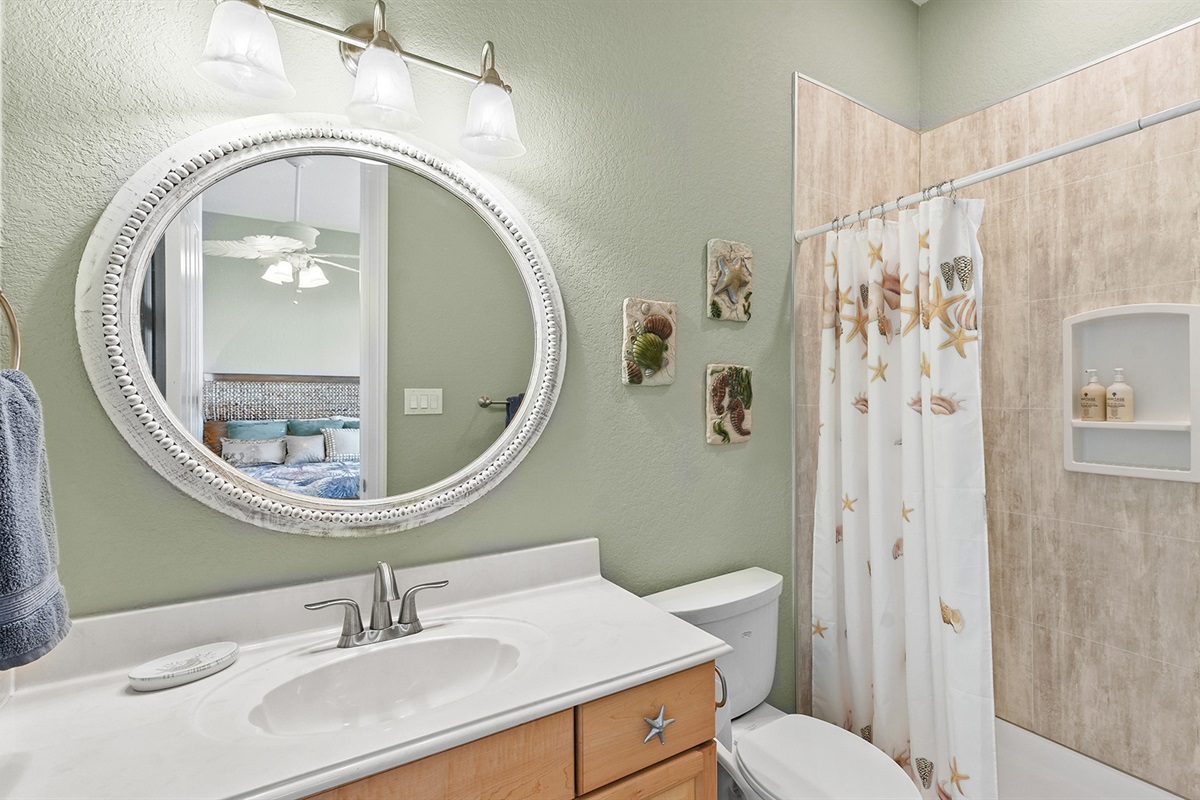 A combination shower/tub facilitates a quick rinse or a relaxing soak.
