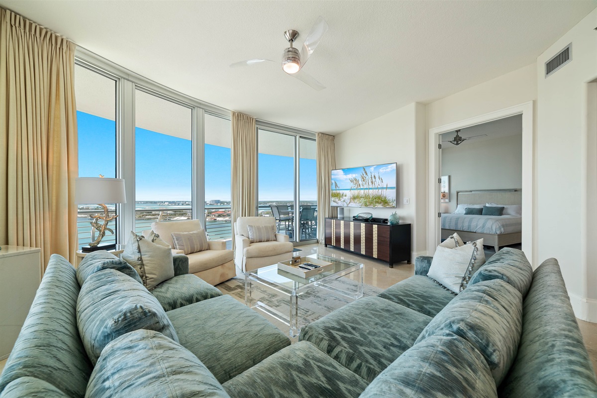 This thoughtfully designed living space maximizes natural light and integrates seamlessly with the surrounding environment. The open-concept layout and expansive windows create a bright and airy atmosphere.