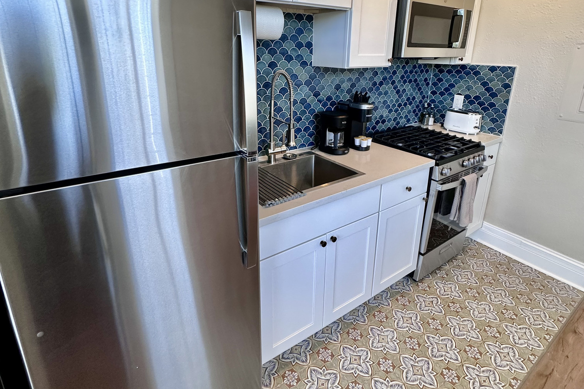 Enjoy the convenience of a private, fully equipped kitchen—perfect for whipping up a meal or a morning coffee.