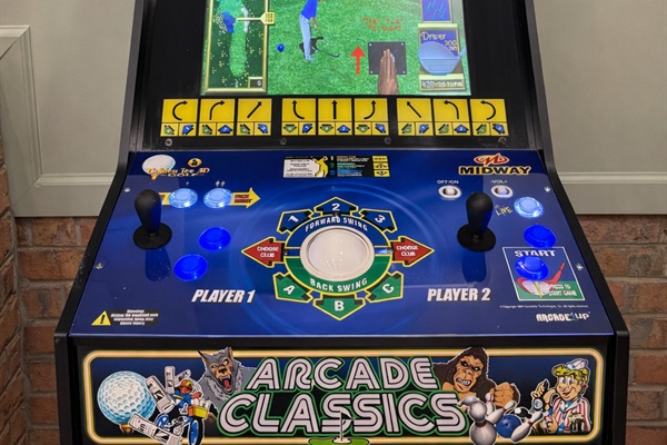 Golden Tee arcade — perfect for friendly competition after the course.