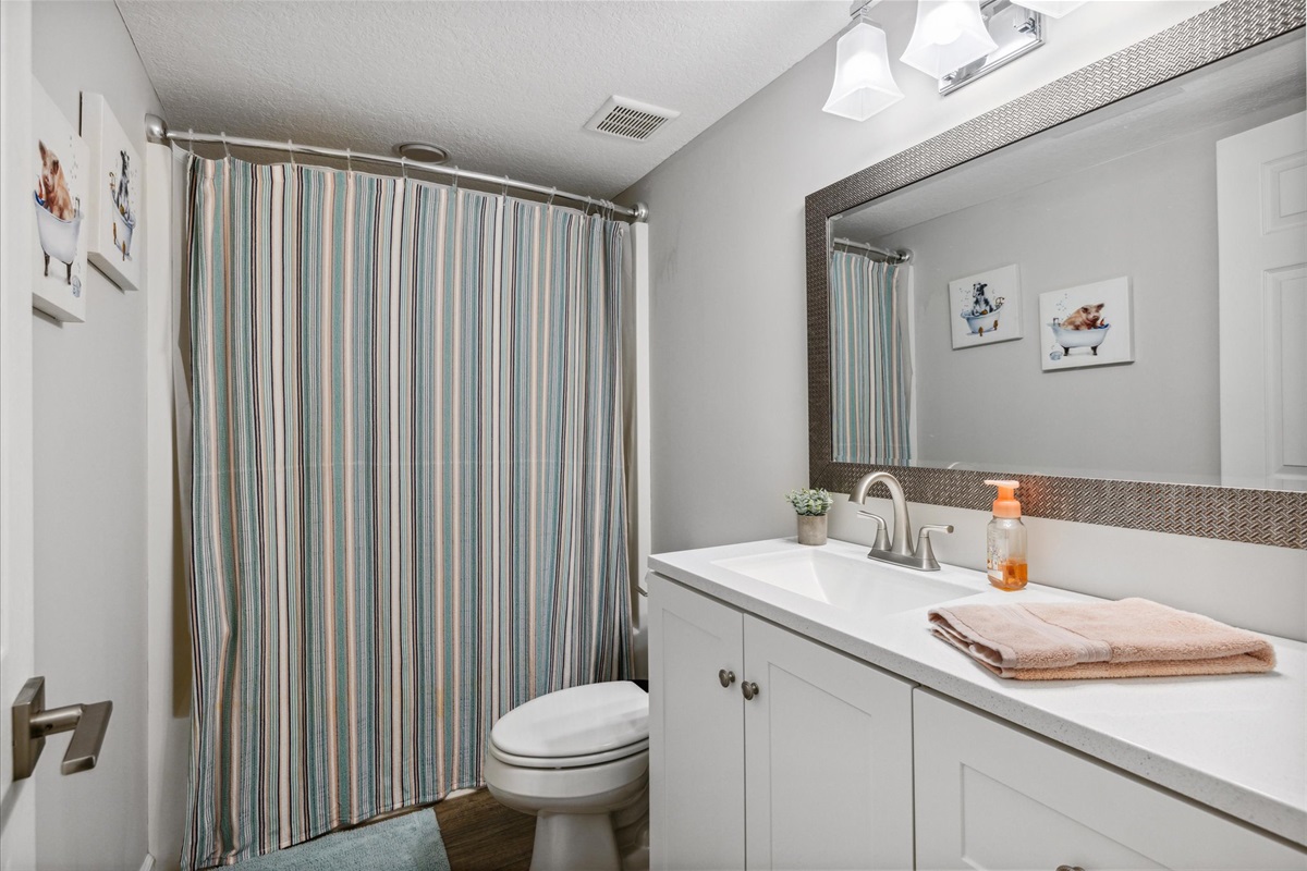 Shared bath across from laundry center