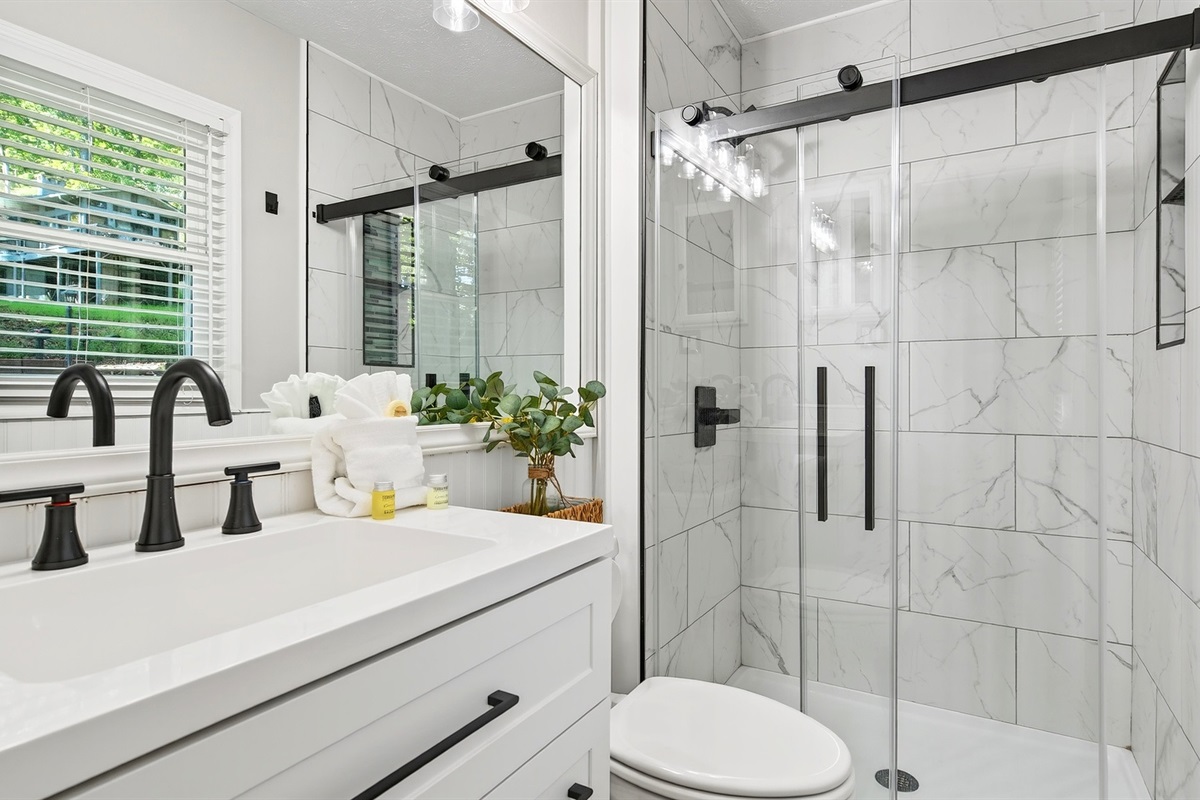 En-suite master bathroom features a walk in shower.