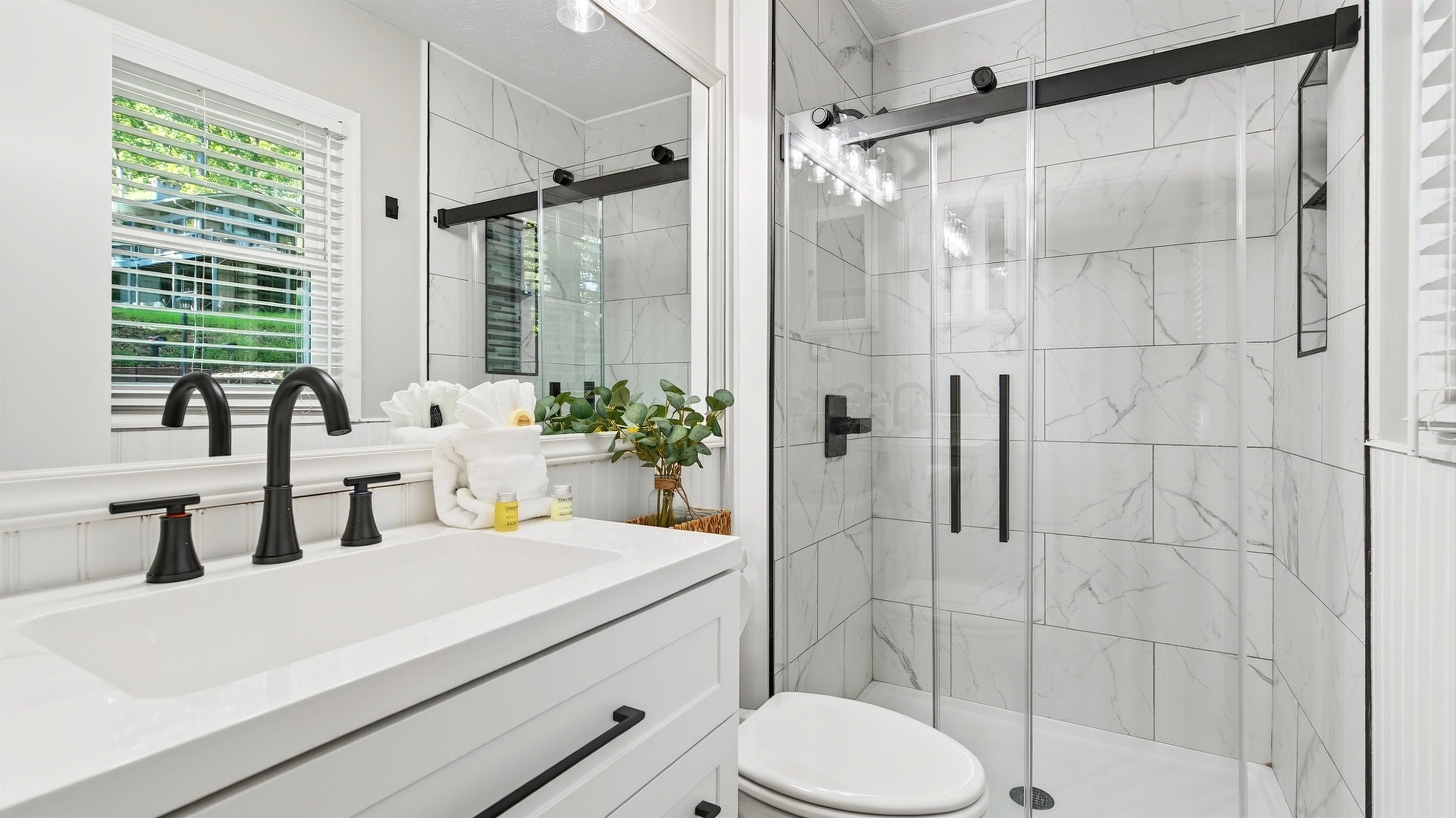 En-suite master bathroom features a walk in shower.