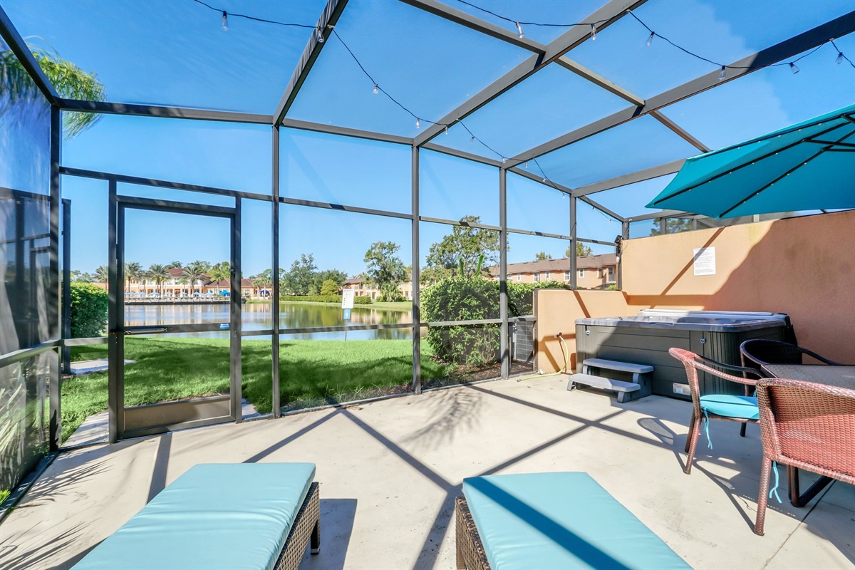 Private covered lanai with hot tub, dining area and lounge are