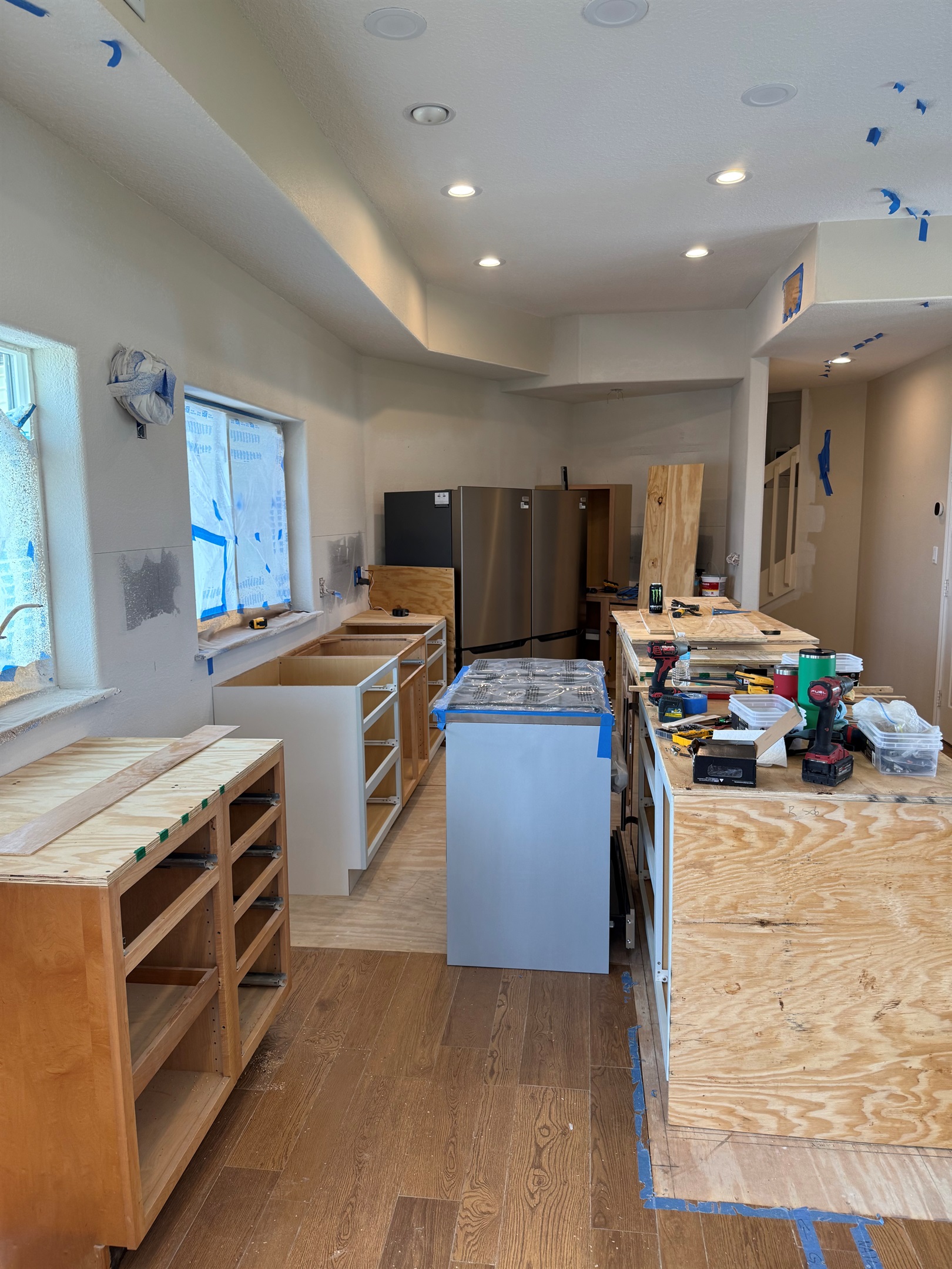 Kitchen in progress with the 6 burner range in the aisle.  Countertops will be quartz. 