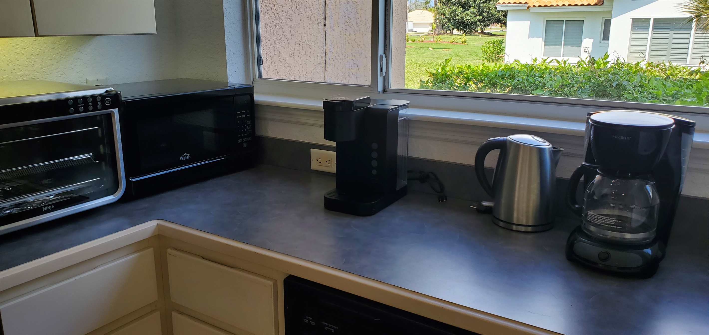 Keurig, Mr. Coffee and hot pot in kitchen