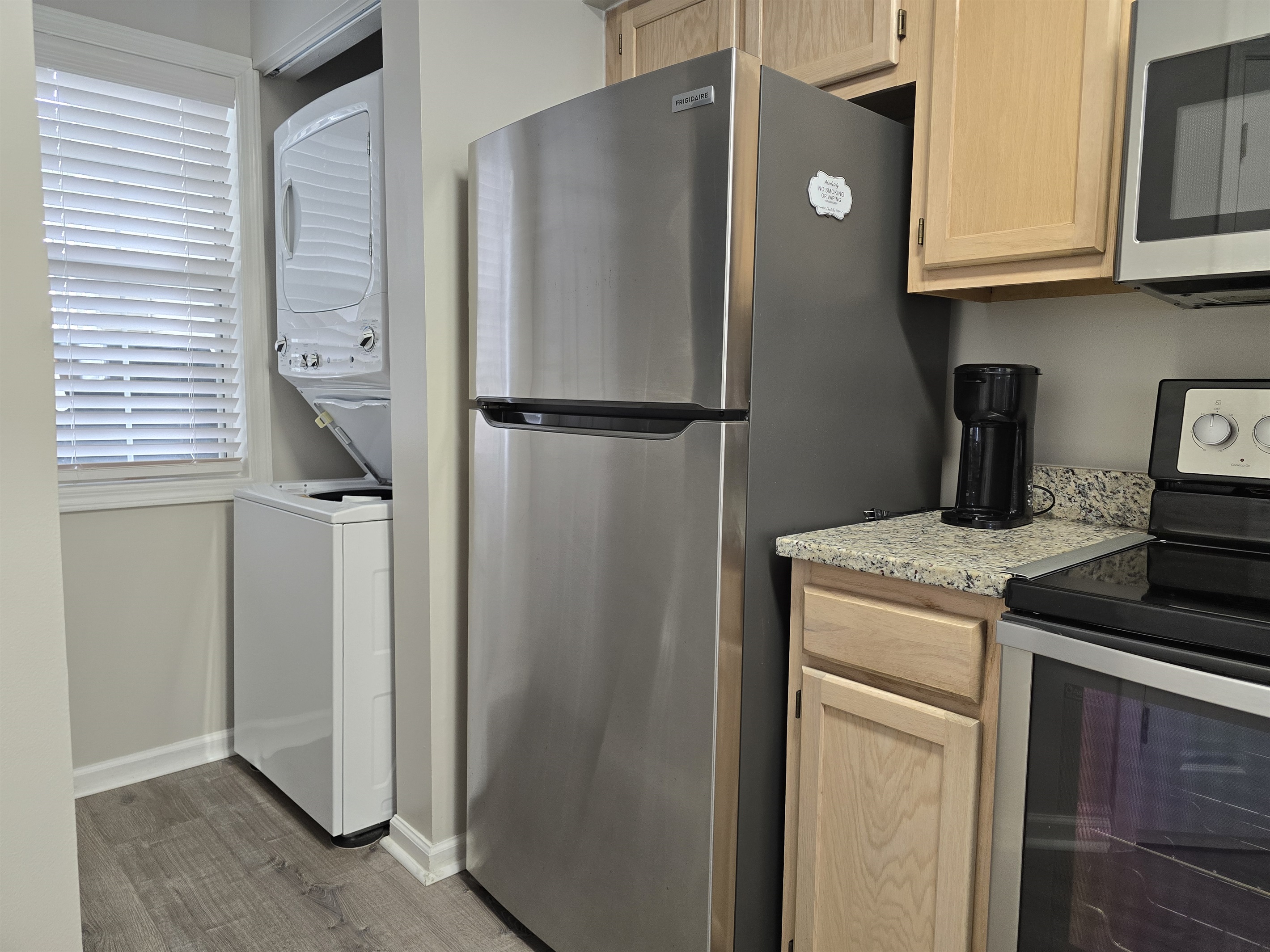 Washer/Dryer Access tucked beside the Kitchen