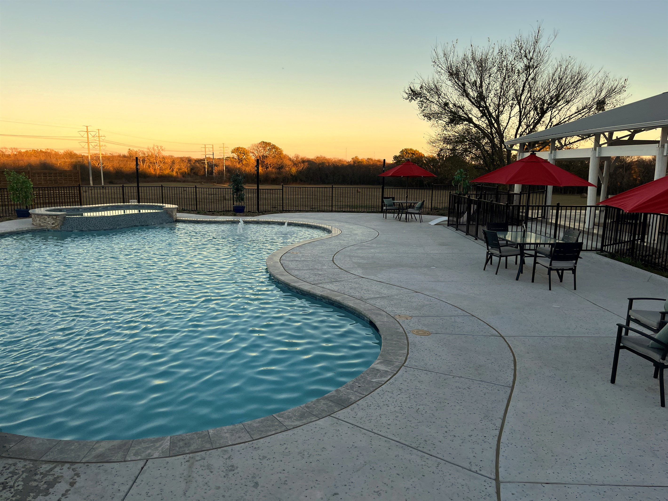 Resort style 30,000-gallon saltwater pool with double waterfalls and grotto and slide