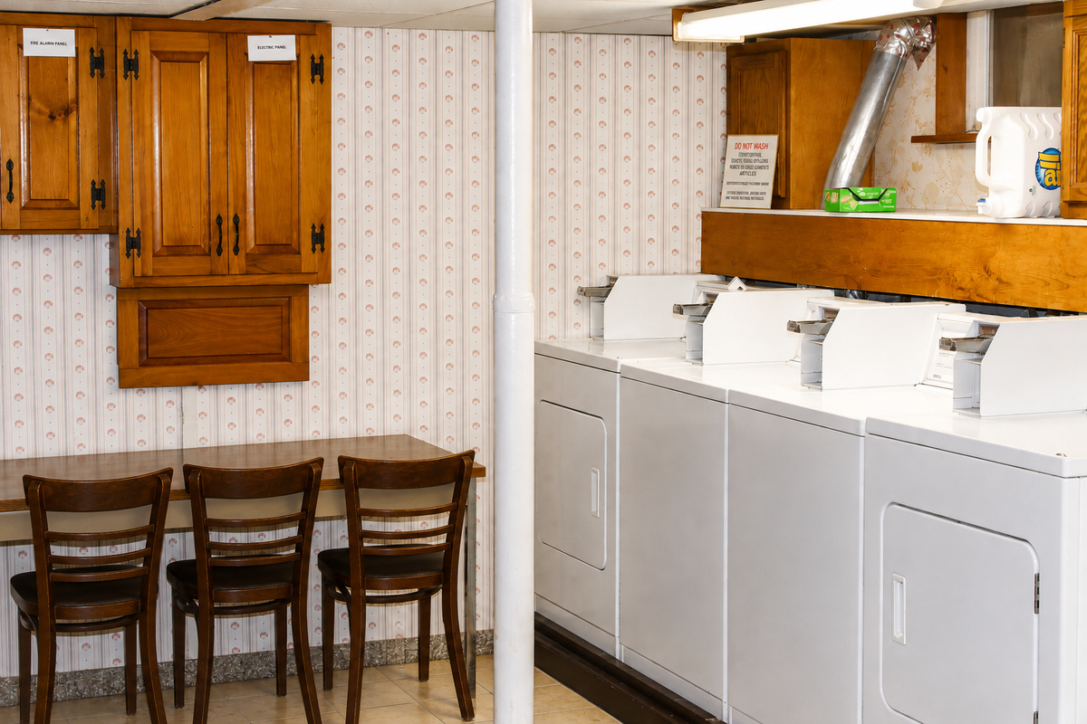 Shared laundry room with multiple washers and dryers - no waiting!