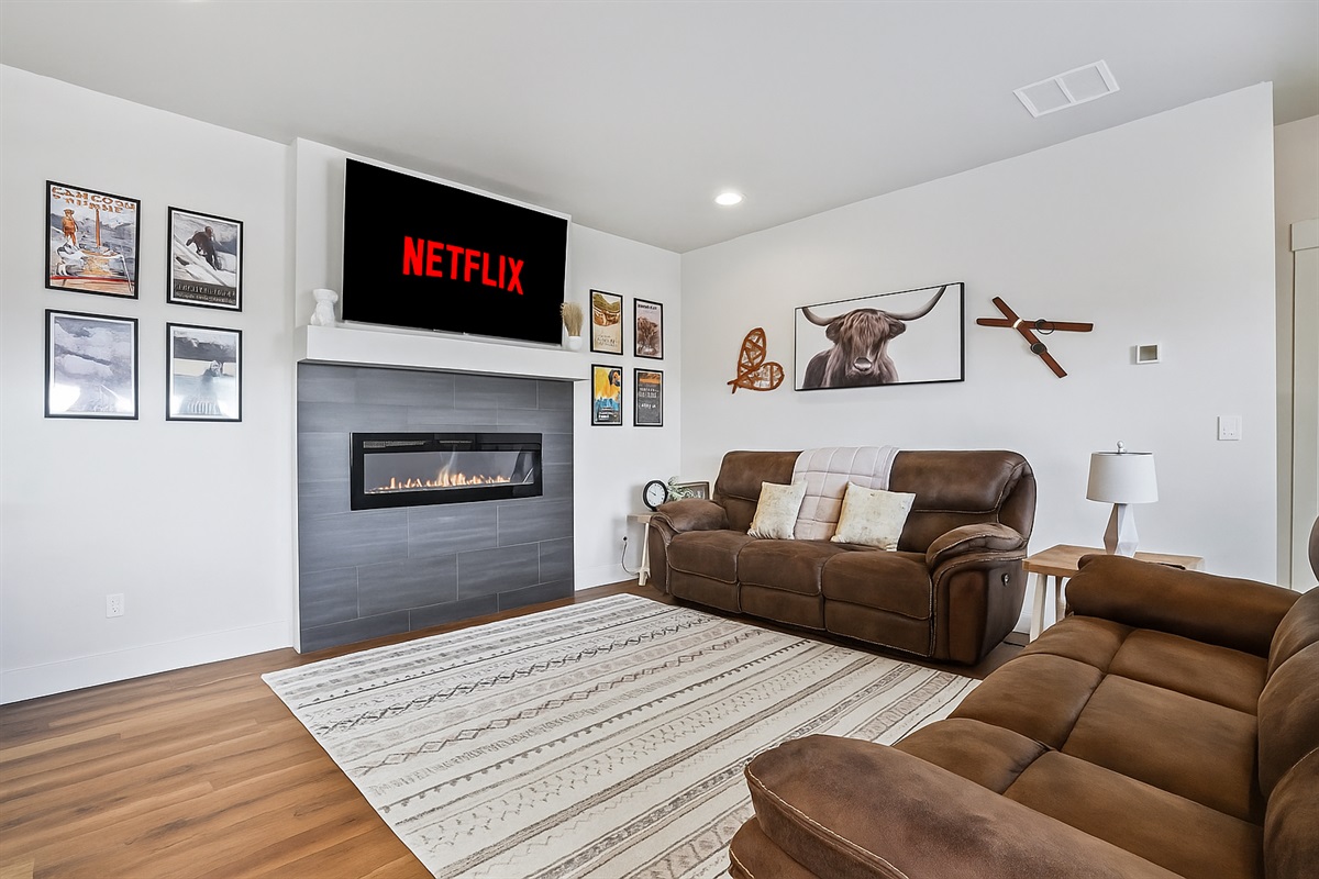 Relax in style by the LED fireplace and stream your favorite shows on Netflix