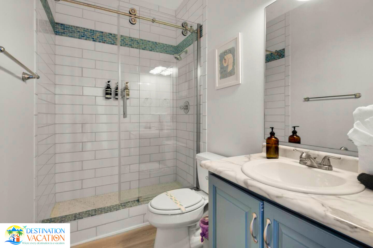 Crisp tilework and elegant fixtures add timeless appeal.