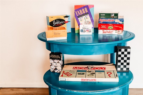 A collection of board games, each box brimming with adventures, strategy, and laughter. I