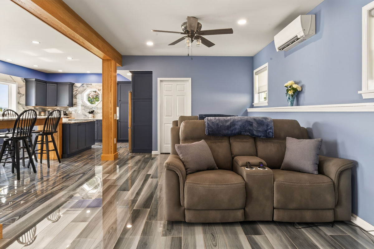Living room with sectional and ceiling fan