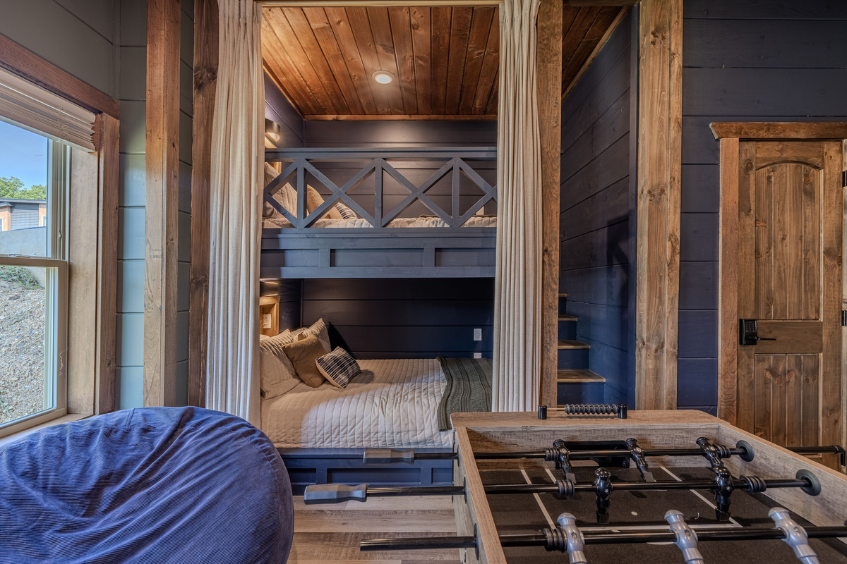 Additional built-in Queen bunks with privacy curtains, individual lights, outlets and phone shelves. 