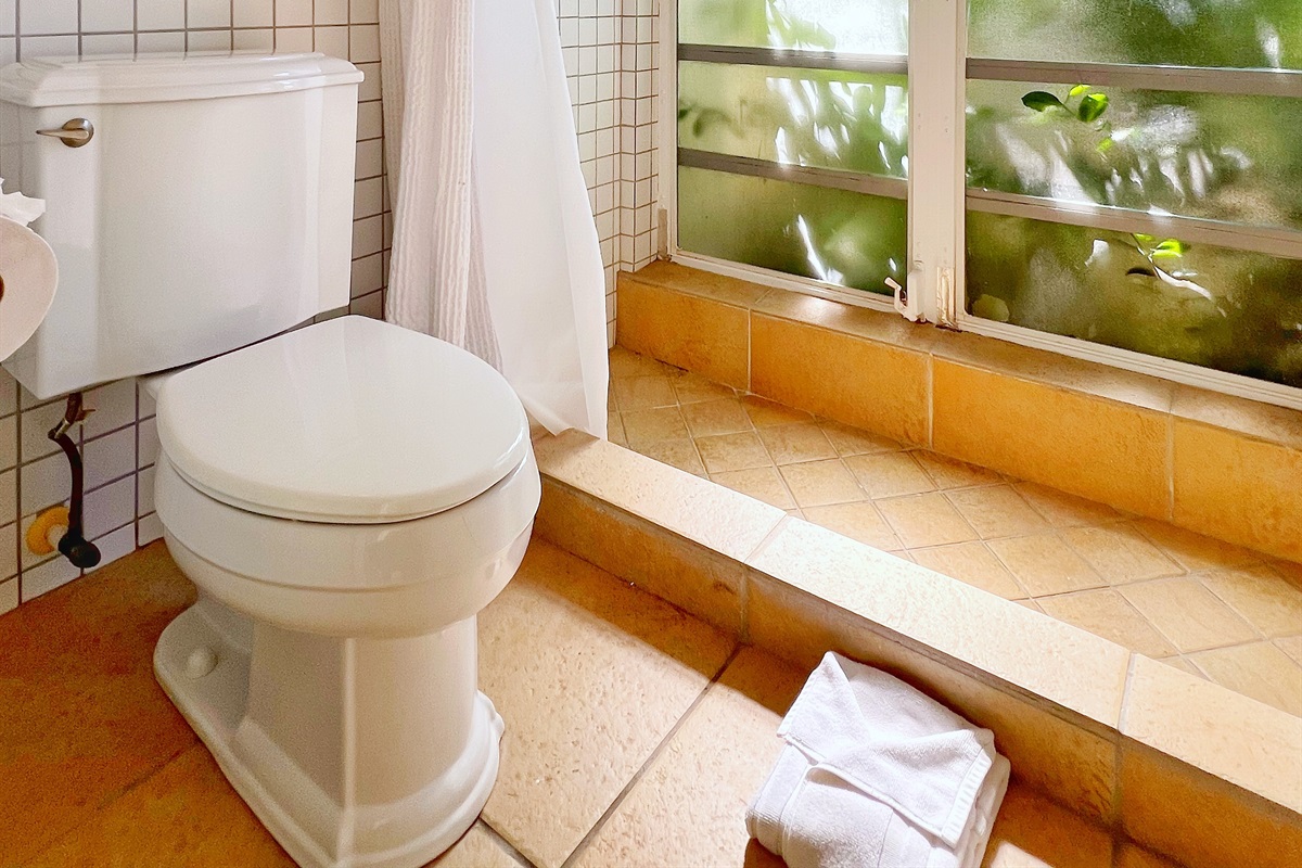 A sleek and modern bathroom designed with convenience in mind.