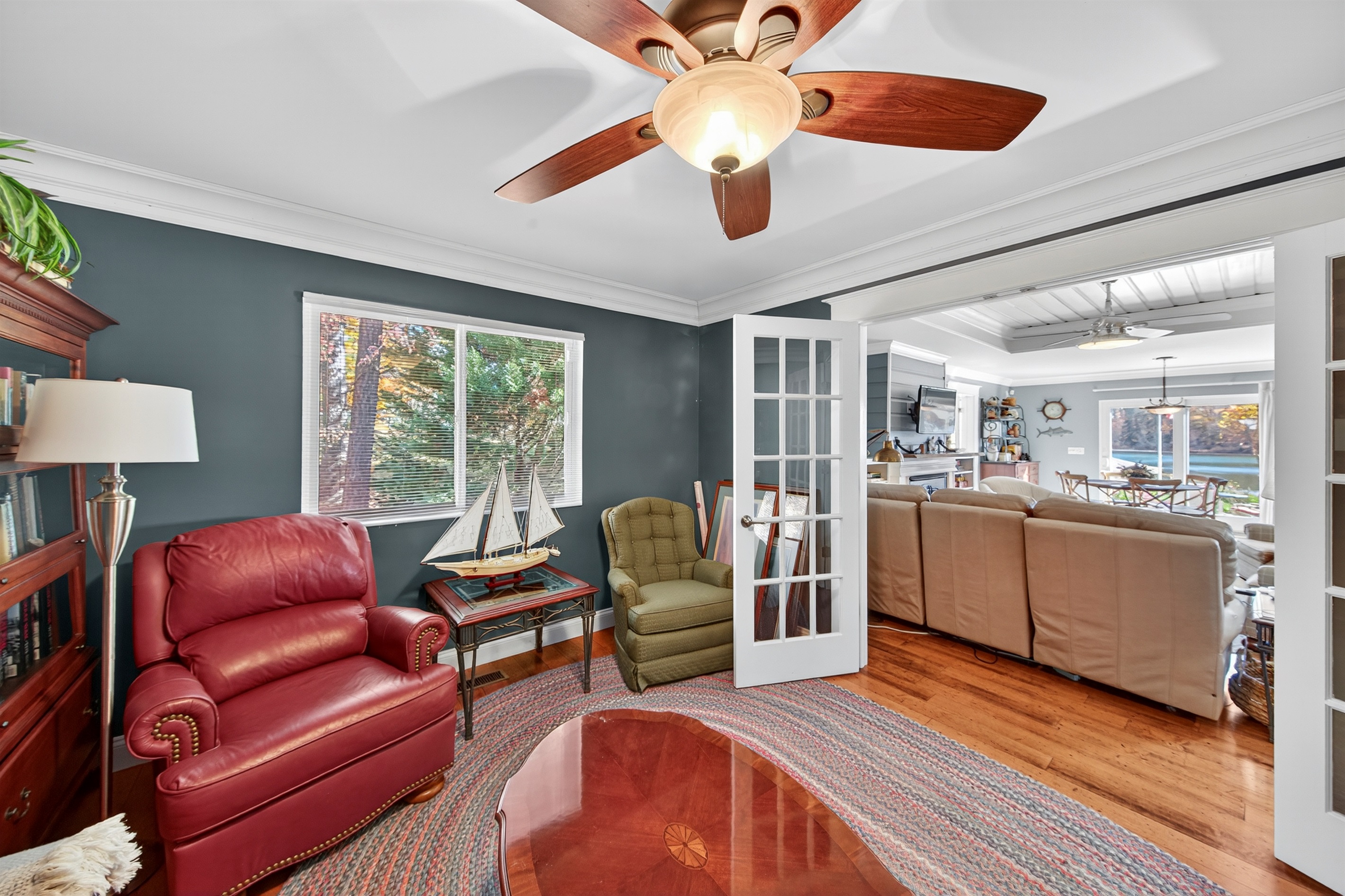 Cozy reading room with French doors overlooking the main living area.
