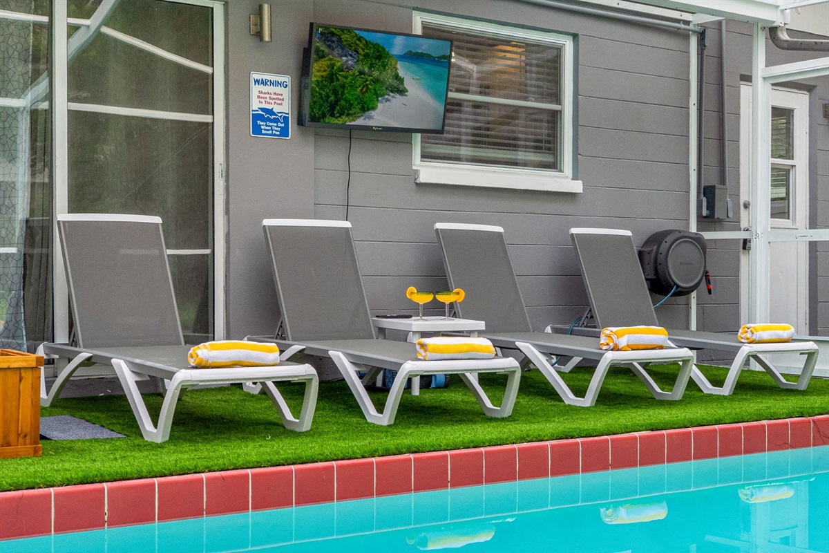 Lined with comfy loungers, fresh towels, and your favorite show playing on the outdoor TV—this is poolside living at its best.