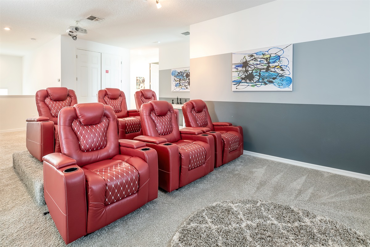 Home Theater: Experience movie nights like never before in luxurious red recliners!