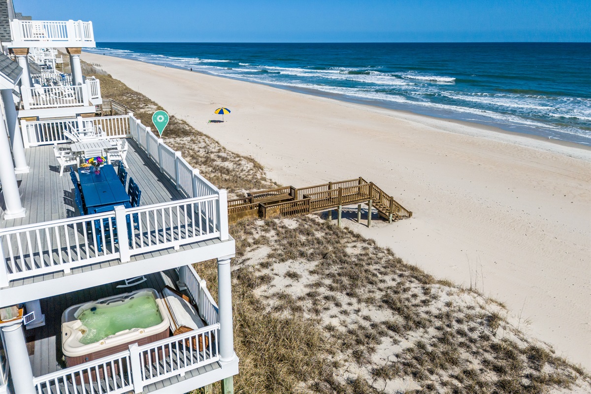 Dine al fresco on the deck with a private boardwalk to the beach.