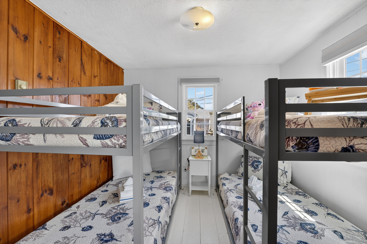 Welcome to our second bedroom with two sets of twin bunk beds! Perfect for shared adventures and sweet dreams!
