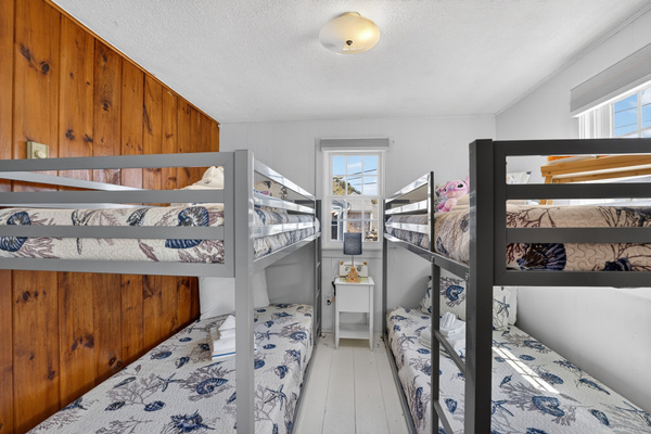 Welcome to our second bedroom with two sets of twin bunk beds! Perfect for shared adventures and sweet dreams!