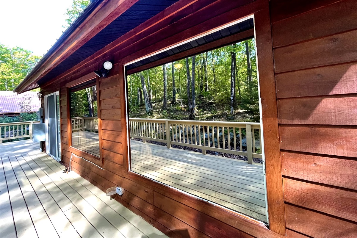 Two huge reflective mirrored panoramic windows you can see out but nature can’t see in! Summer views 