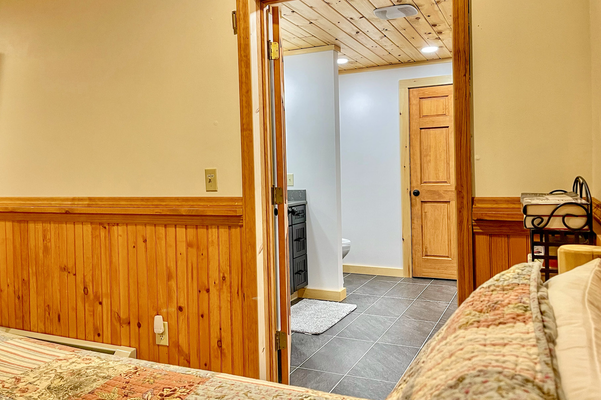 Ensuite bathroom 3 is located just off bedroom 4 on the lower level. 