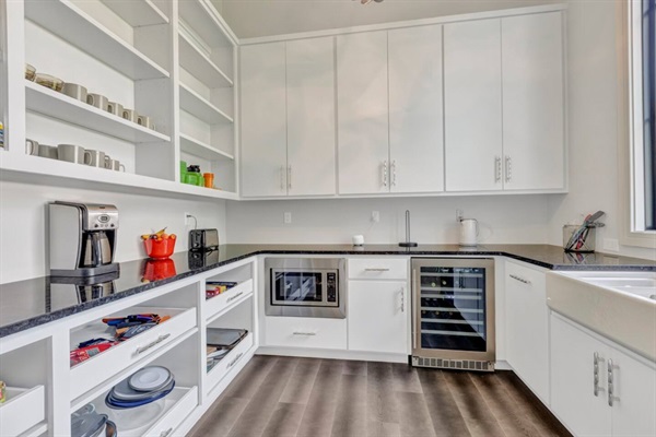 The butler's pantry attached to the kitchen offers a coffee station, dual temperature wine fridge, and excellent storage space.