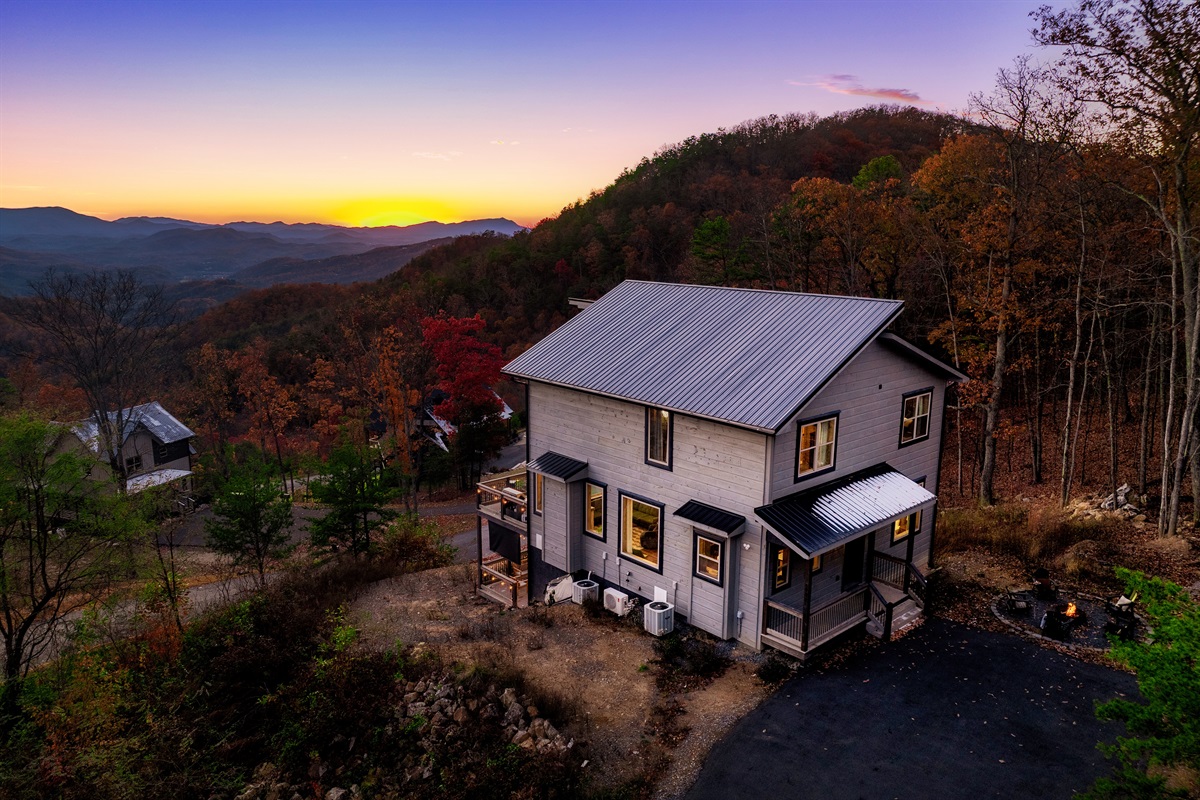 Aerial side view showcasing the cabin’s space, privacy, and setting.
