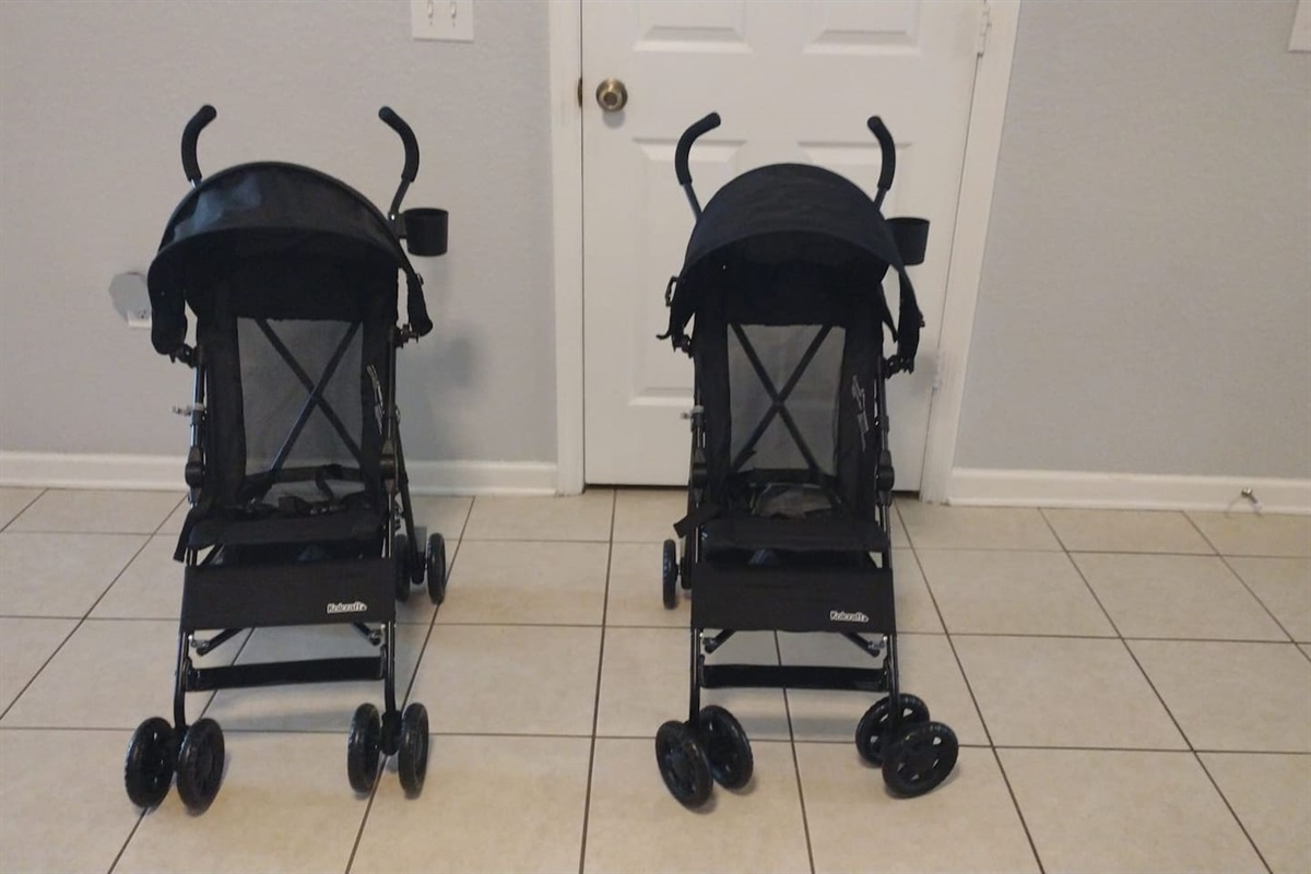 Two lightweight strollers ready for guest use.

