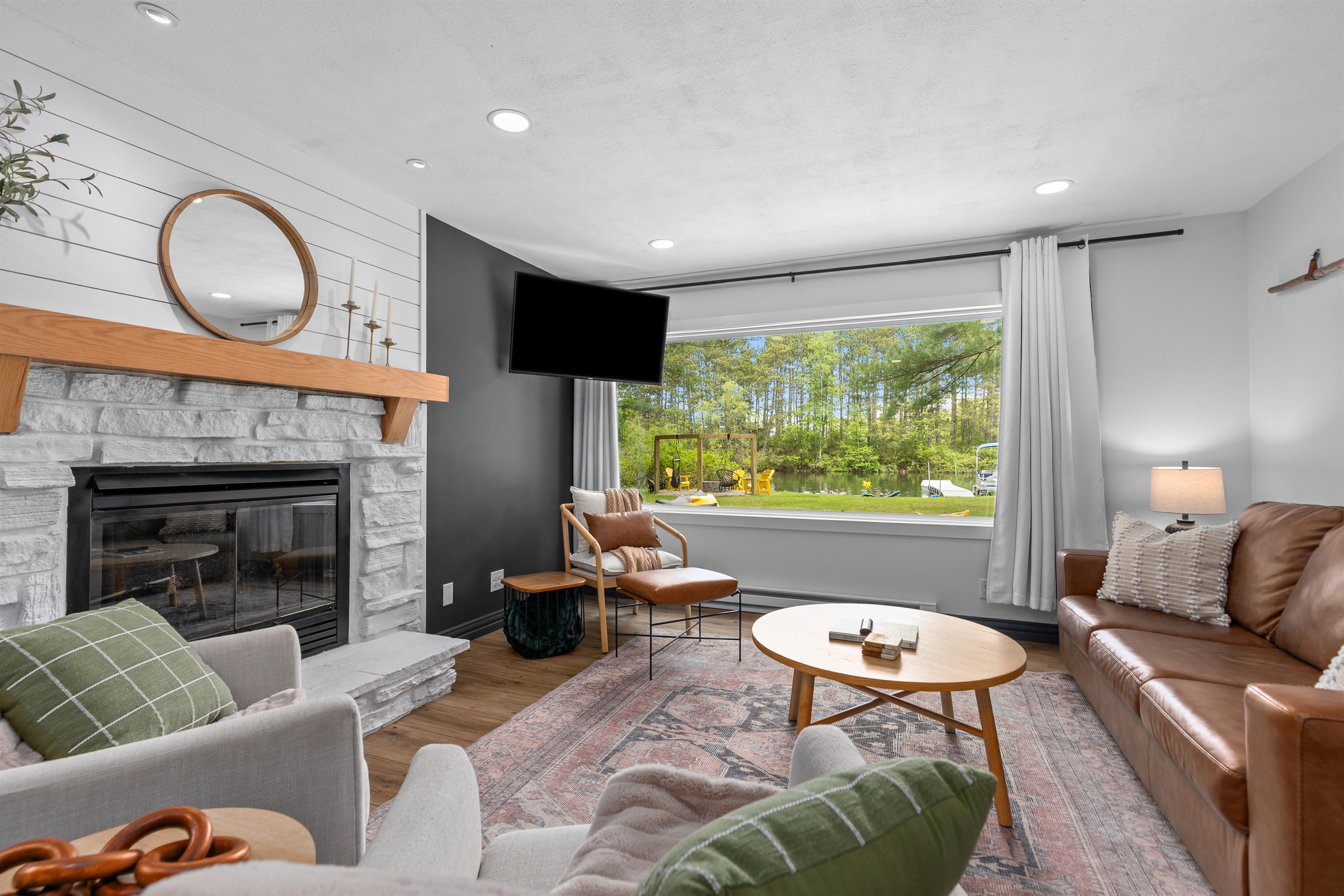 Large windows bring the beauty of the outdoors in, creating a bright and relaxing space.