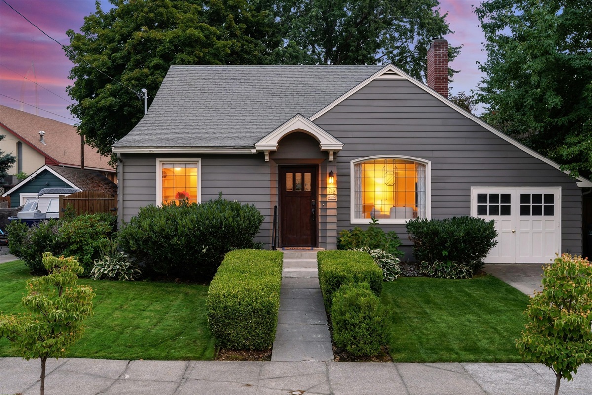 Front entrance with one off-street parking spot in front of the garage