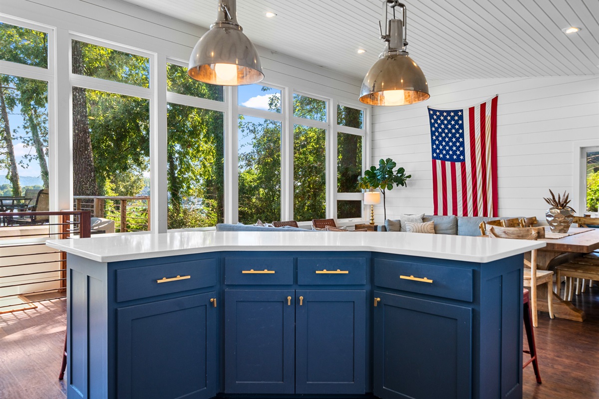 Spacious kitchen with island seating and panoramic views—heart of the home.