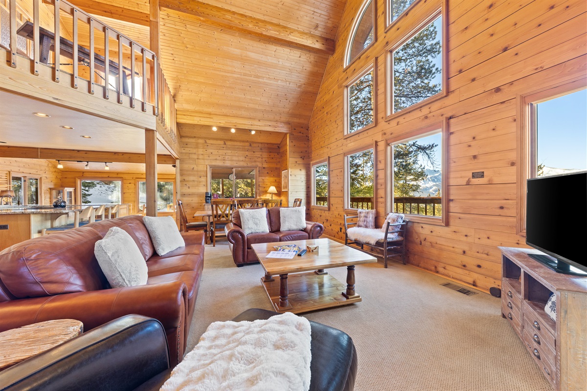Main living area with kitchen and dining in background