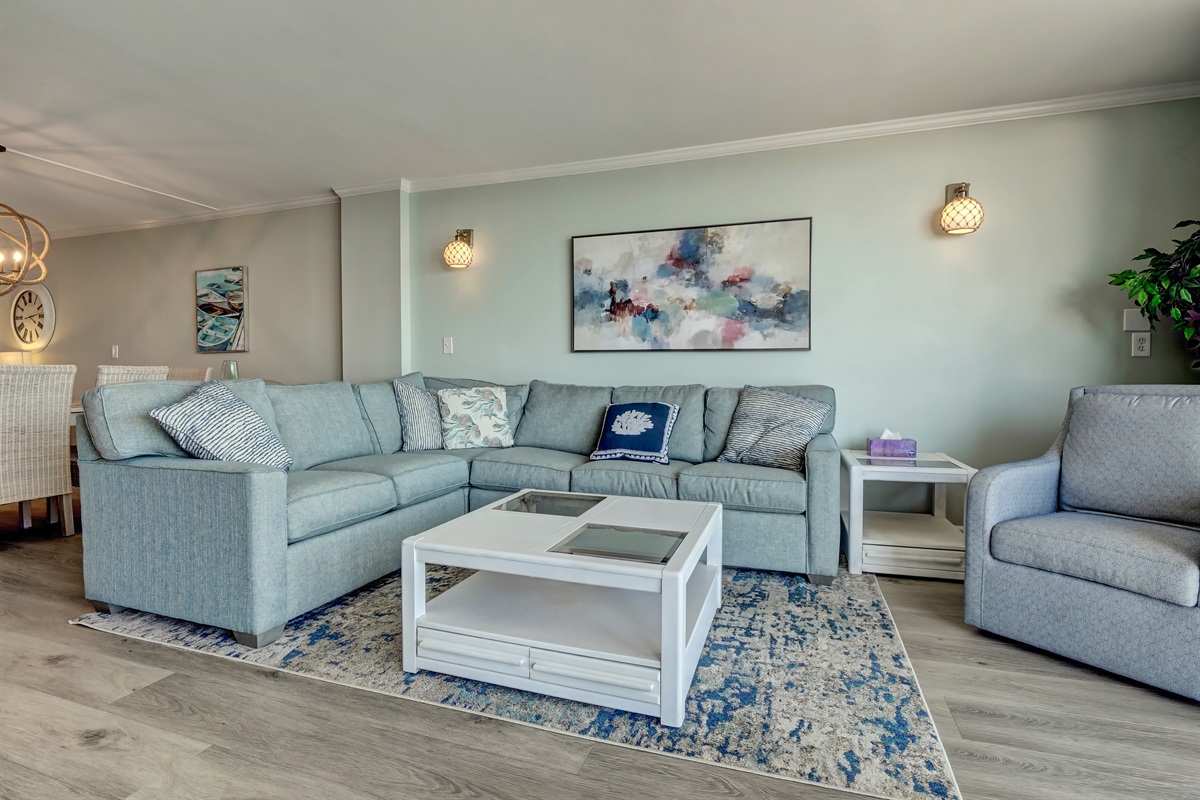 Living room has a comfortable sectional with queen sleeper