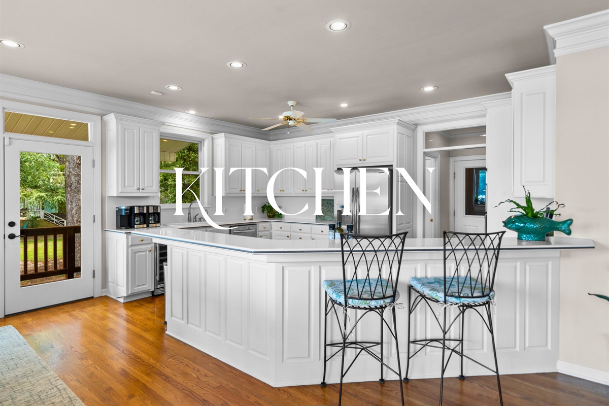 Whip up meals in this pristine, open kitchen &mdash; complete with lake views and room to gather.