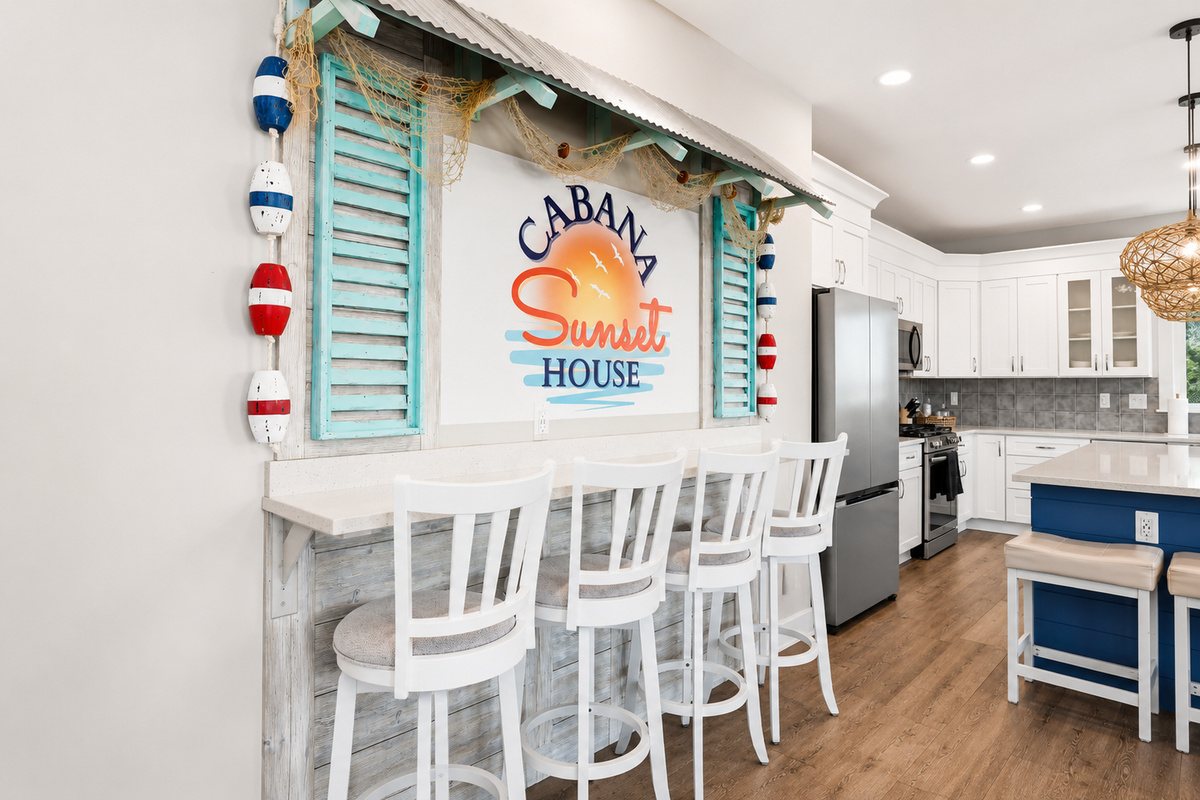 Come together in this bright, fully equipped kitchen and inviting dining area with bar seating—the perfect place to cook, share meals, and create lasting memories.