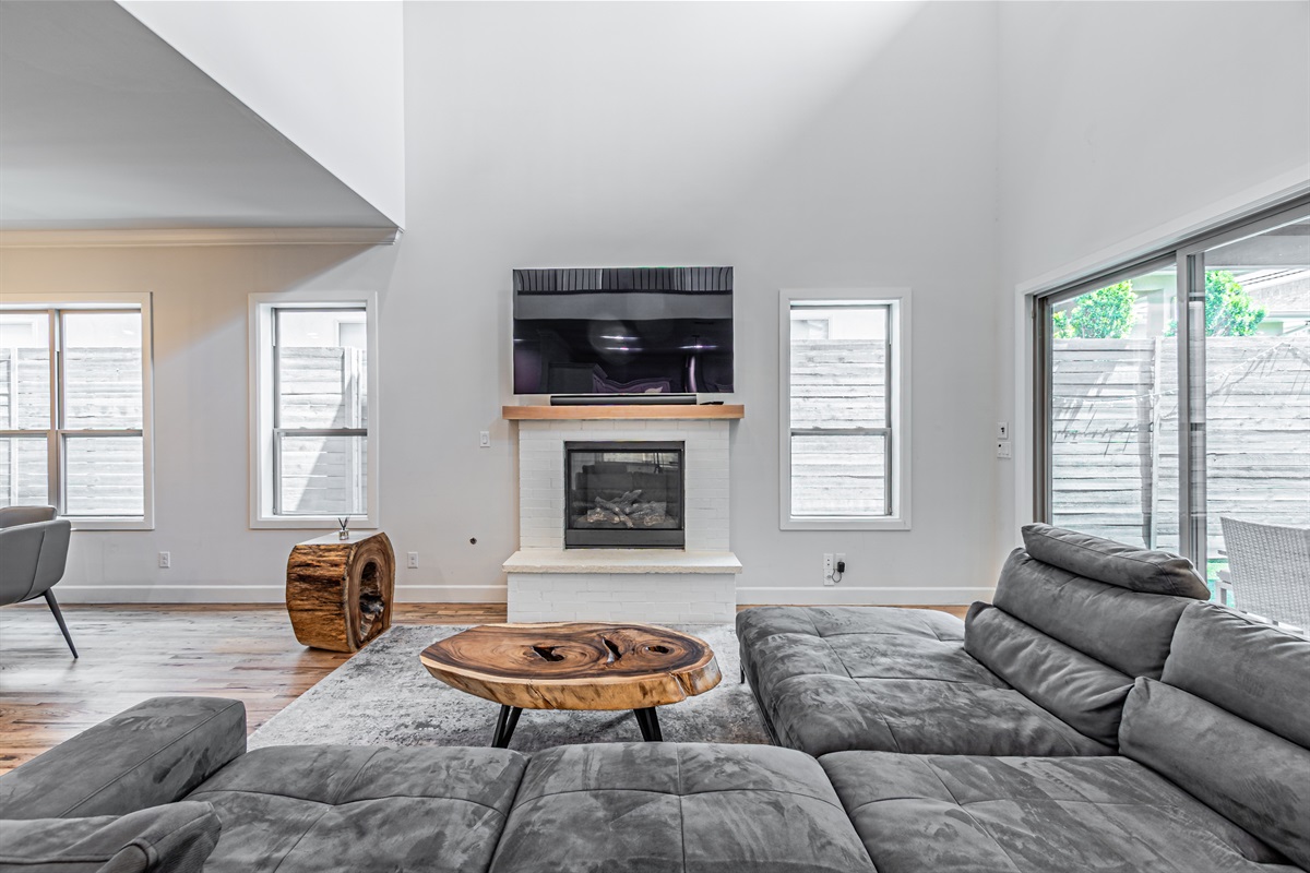 Open-concept living space with natural light and comfortable seating