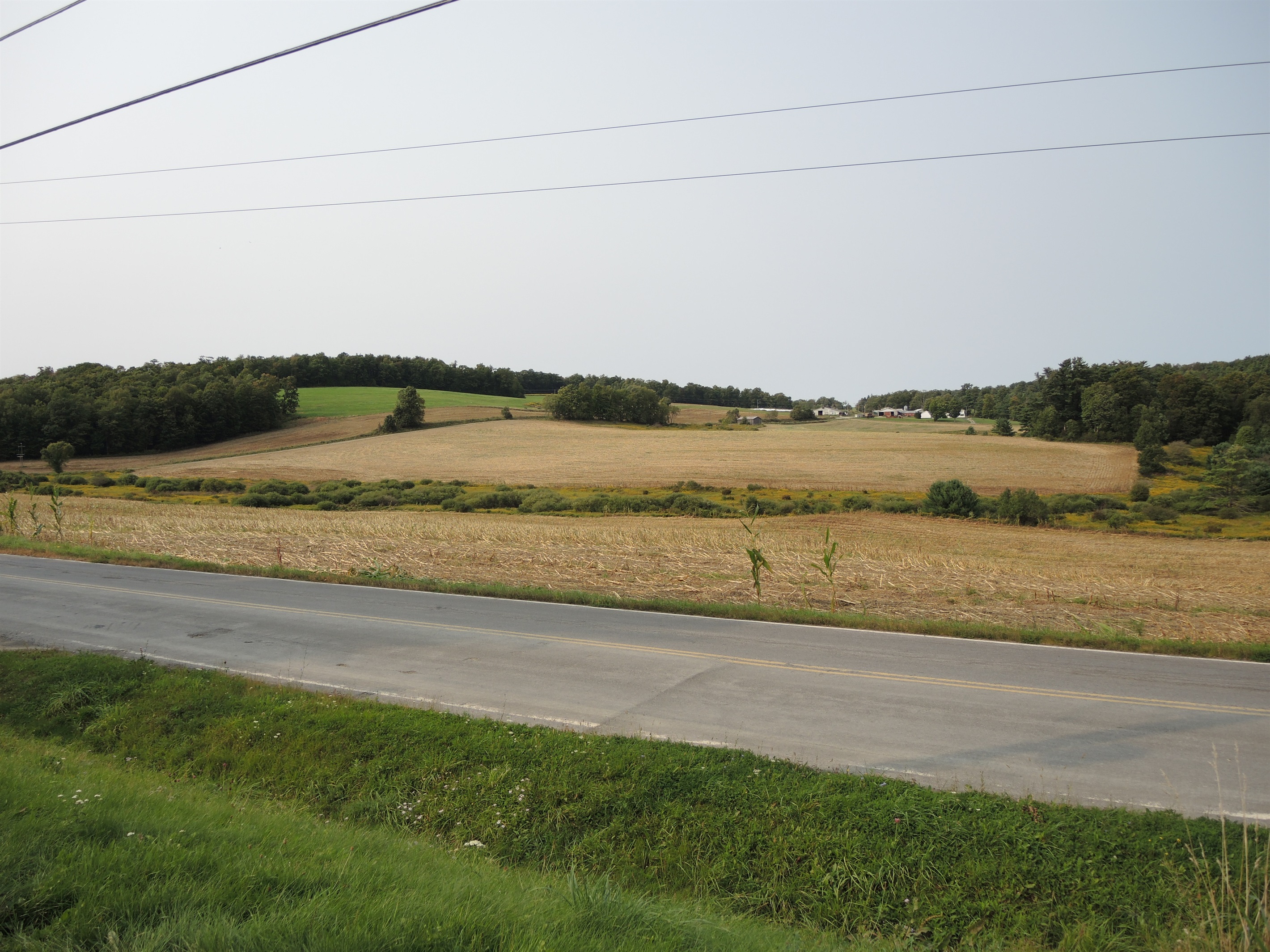 View across the street of rolling hills