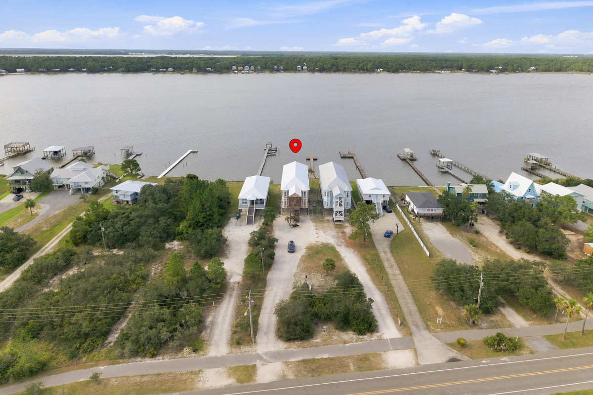 Aerial view of the home and its Little Lagoon setting