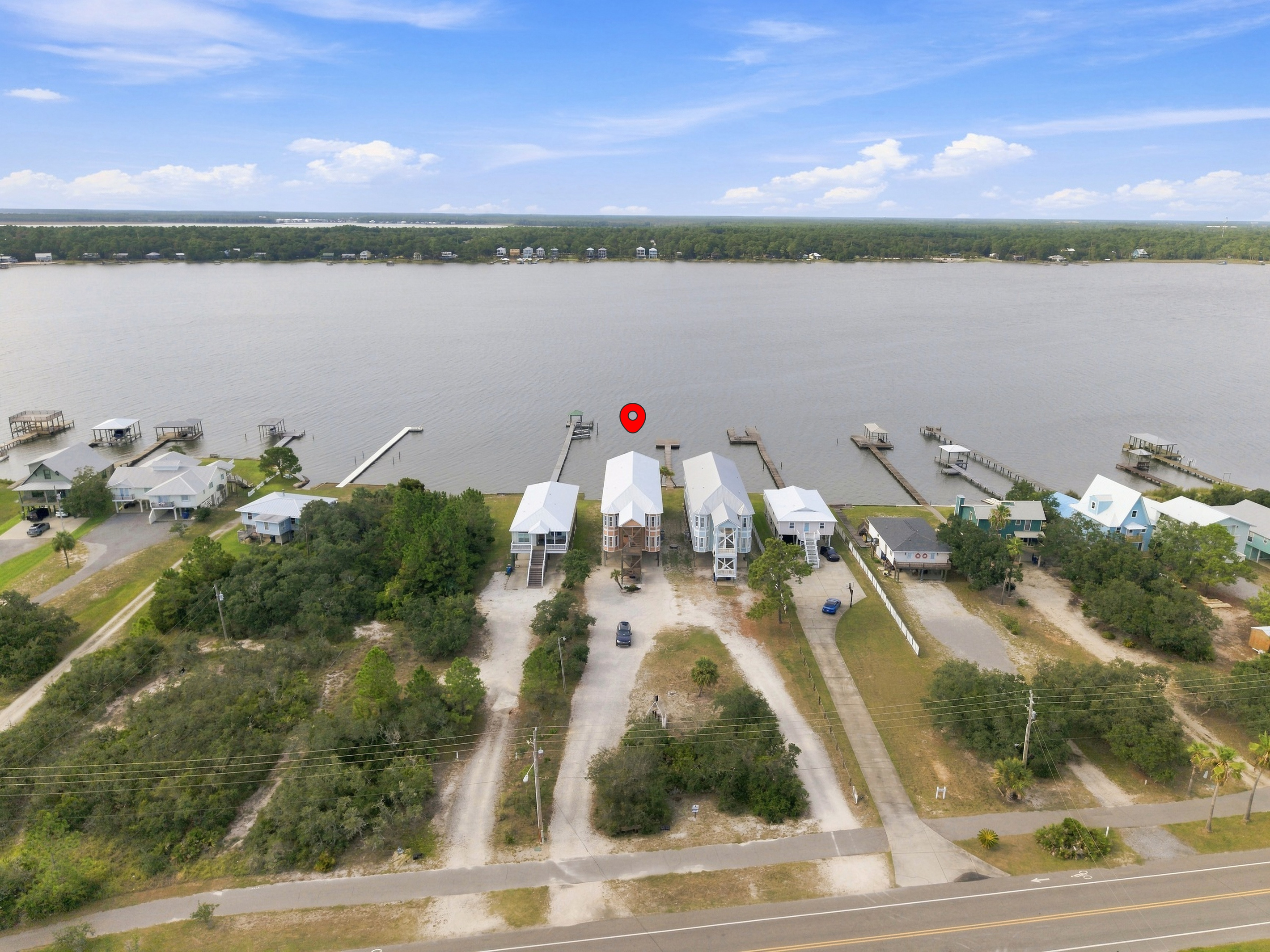 Aerial view of the home and its Little Lagoon setting