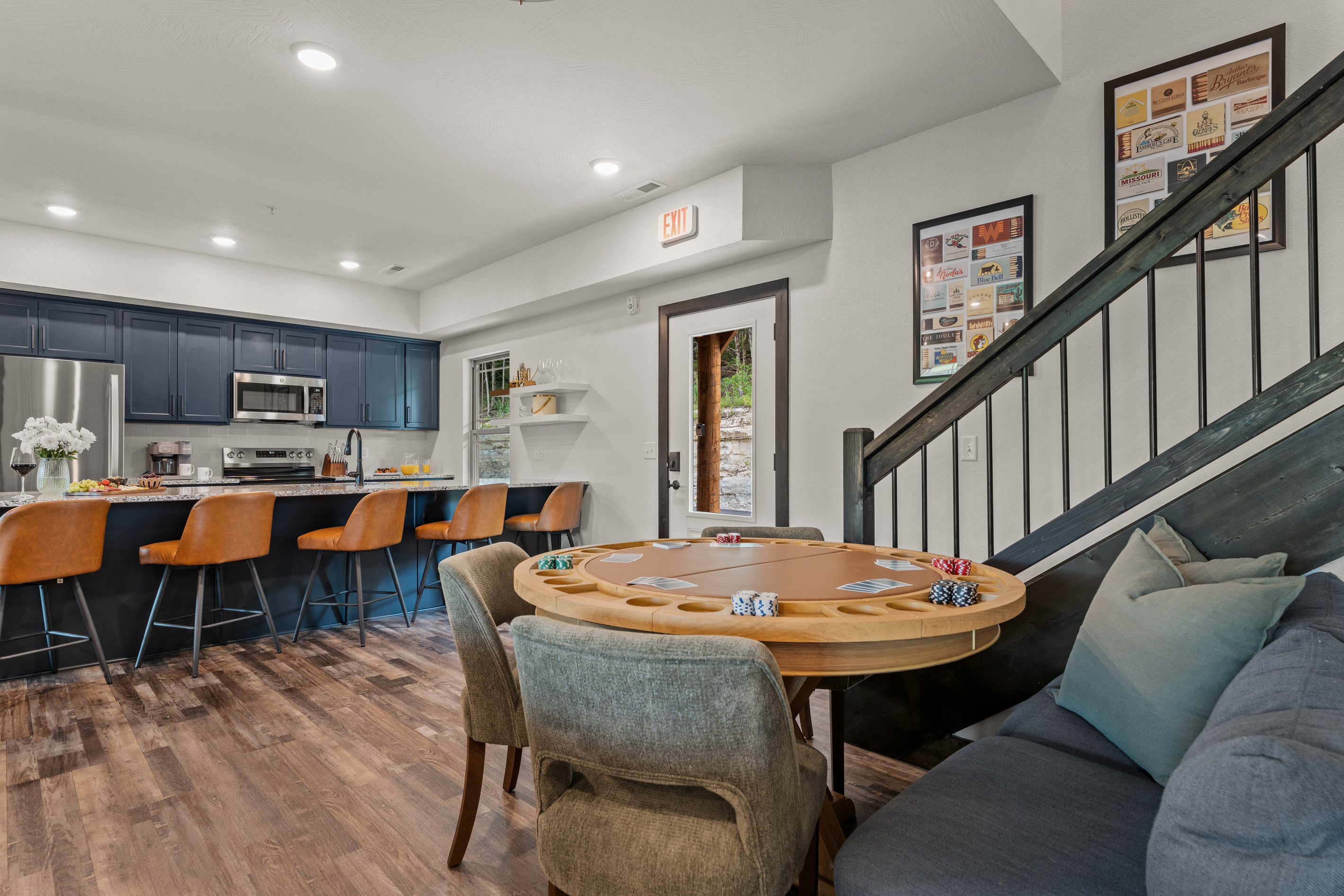 Snacks on the navy island, chips on the poker table – the game corner sits right off the kitchen.